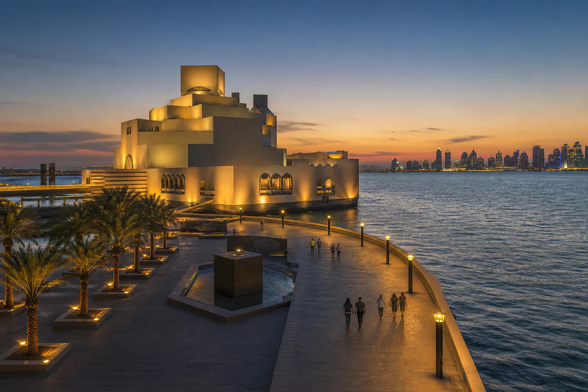 Blue-hour view of Qatar's Museum of Islamic Art and the Doha Corniche waterfront with travellers.