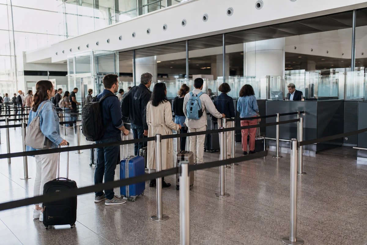 International travellers in a modern airport, illustrating Schengen Calculator Apps vs Multi-Country Trackers: Which One Do You Need?.